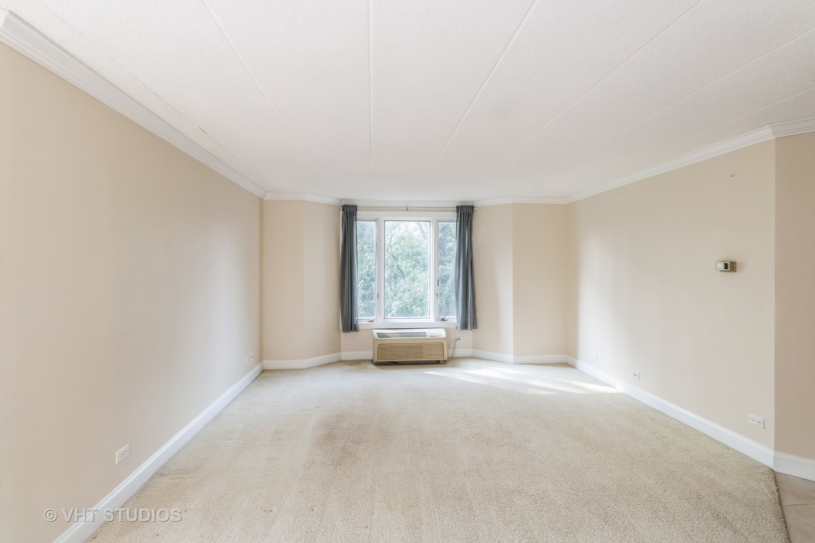 1 Renaissance Place, Unit 217 Palatine, IL 60067 - Photo 15 of 17 a view of a big room with windows and chandelier fan
