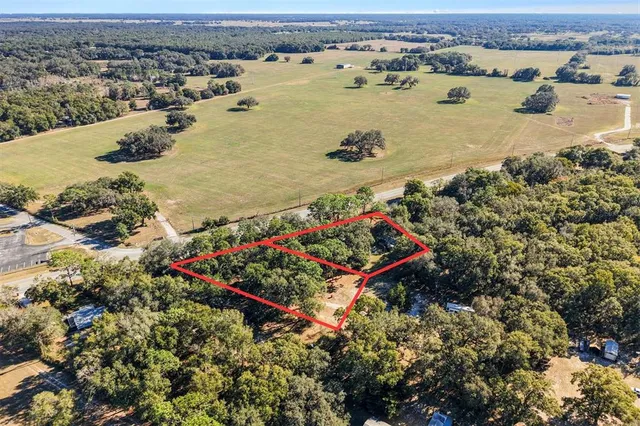 an aerial view of a houses with outdoor space