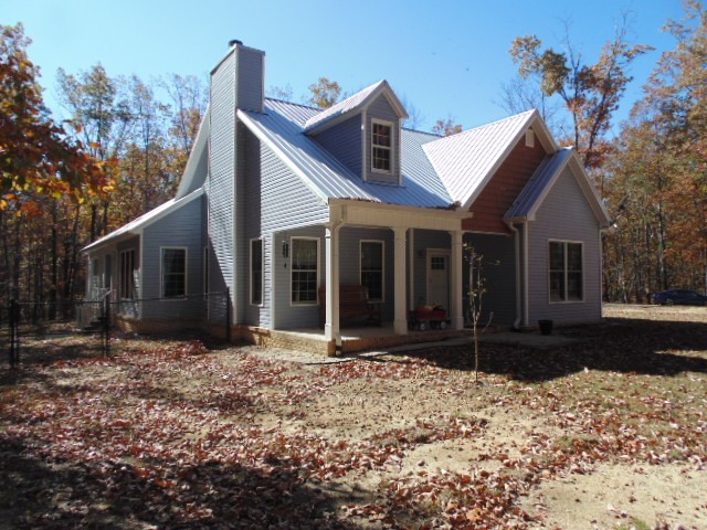 1024 Deepwoods Road Sewanee, TN 37375 - Photo 1 of 38 a front view of a house with a yard