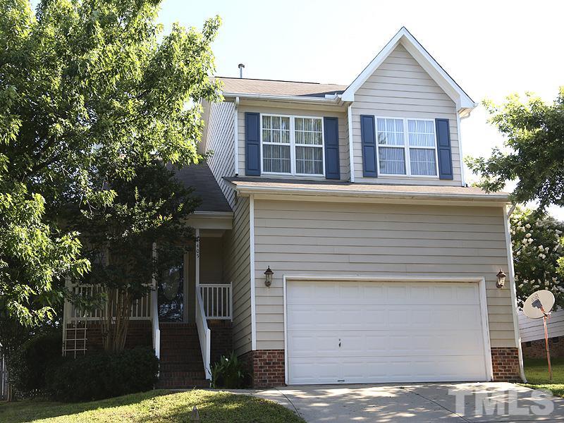 4405 Moss Spring Drive Raleigh, NC 27616 - Photo 1 of 12 a front view of a house with garden