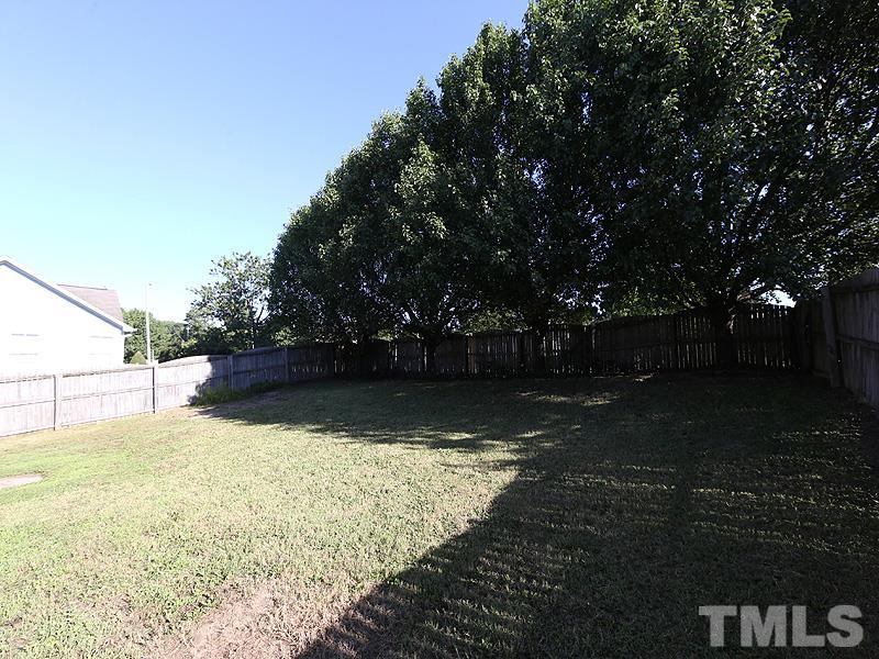 4405 Moss Spring Drive Raleigh, NC 27616 - Photo 11 of 12 a view of backyard with green space
