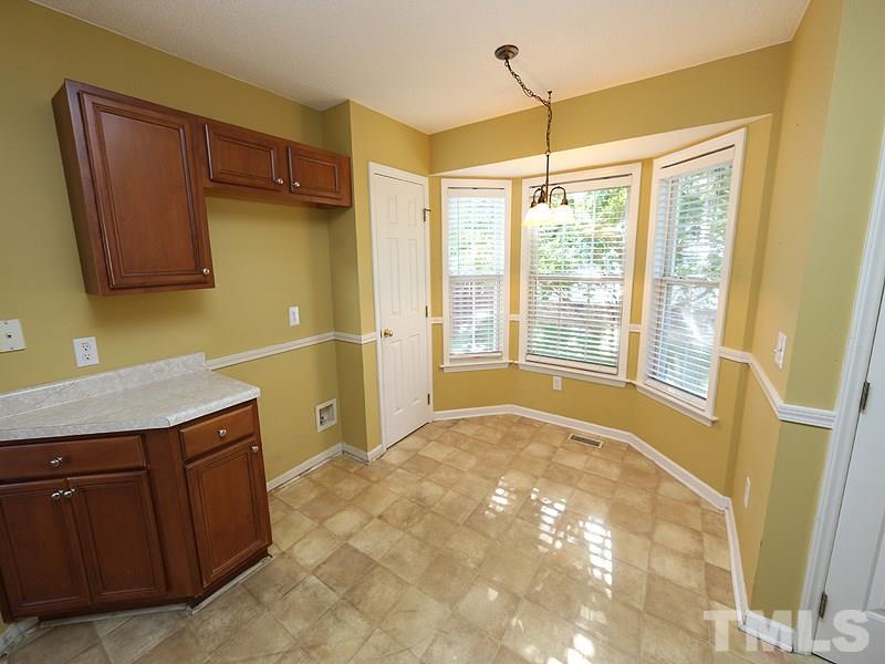 4405 Moss Spring Drive Raleigh, NC 27616 - Photo 5 of 12 a view of a kitchen with a sink and dishwasher