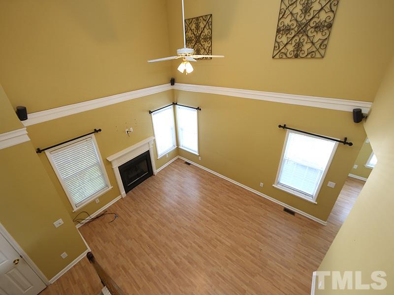 4405 Moss Spring Drive Raleigh, NC 27616 - Photo 6 of 12 a view of an empty room with wooden floor and a window