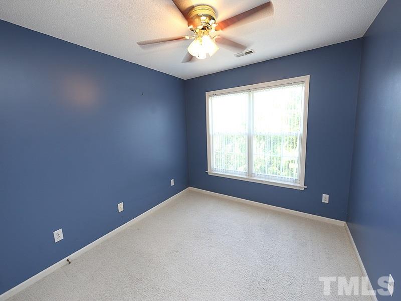 4405 Moss Spring Drive Raleigh, NC 27616 - Photo 10 of 12 an empty room with a window and a fan
