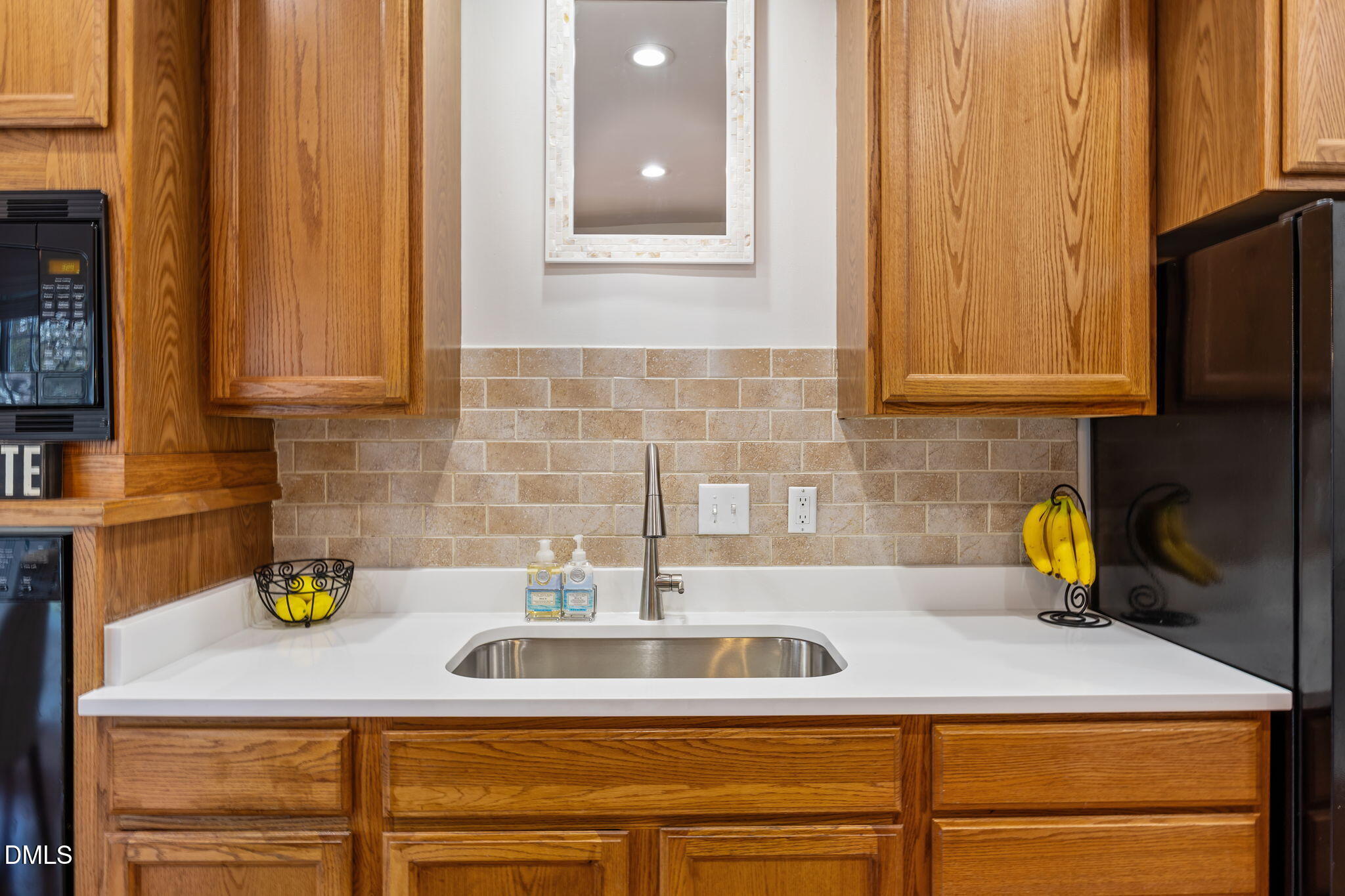 7 Bethany Place Durham, NC 27712 - Photo 11 of 33 a kitchen with a sink and cabinets