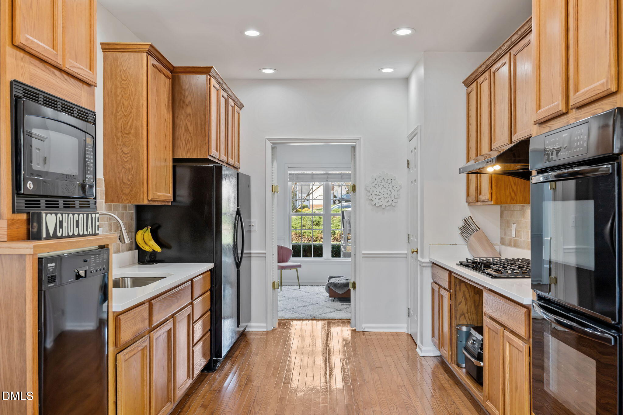 7 Bethany Place Durham, NC 27712 - Photo 12 of 33 a kitchen with stainless steel appliances granite countertop a refrigerator a stove top oven a sink and dishwasher