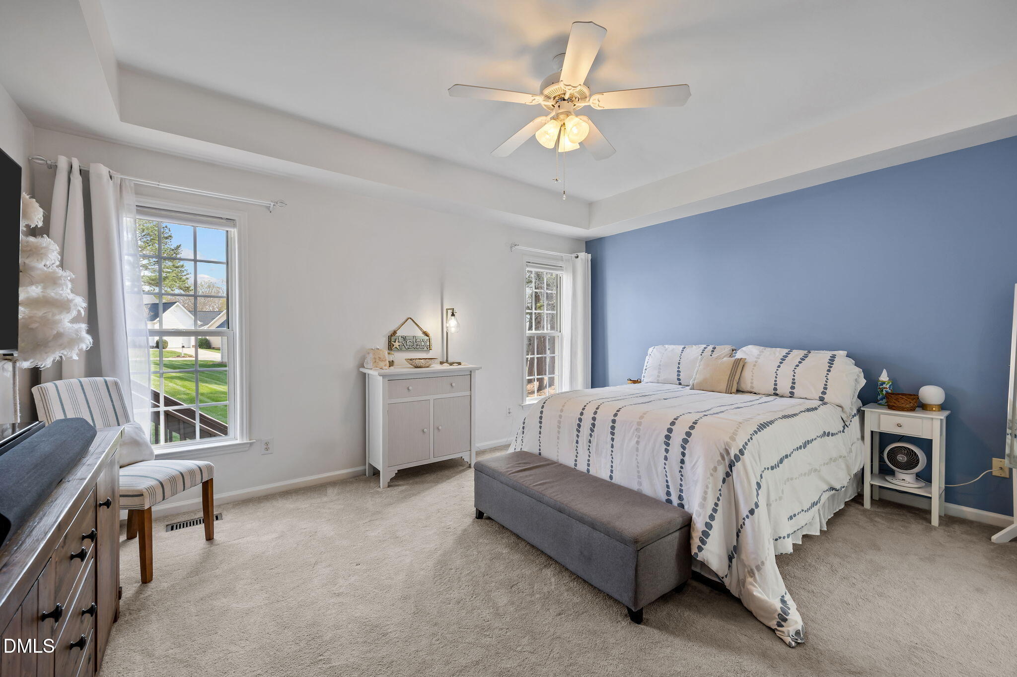 7 Bethany Place Durham, NC 27712 - Photo 15 of 33 a spacious bedroom with a bed and a chandelier
