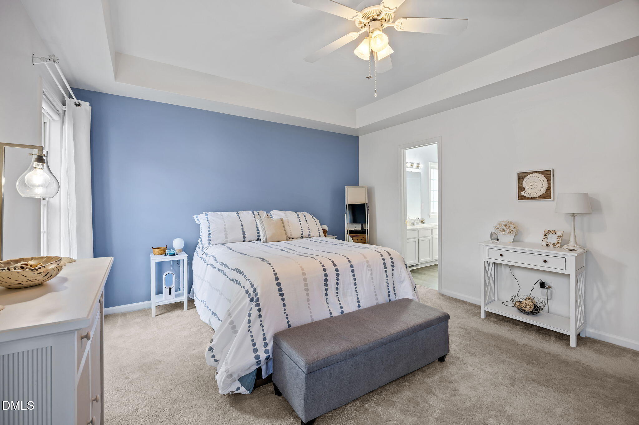 7 Bethany Place Durham, NC 27712 - Photo 16 of 33 a spacious bedroom with a bed and a chandelier