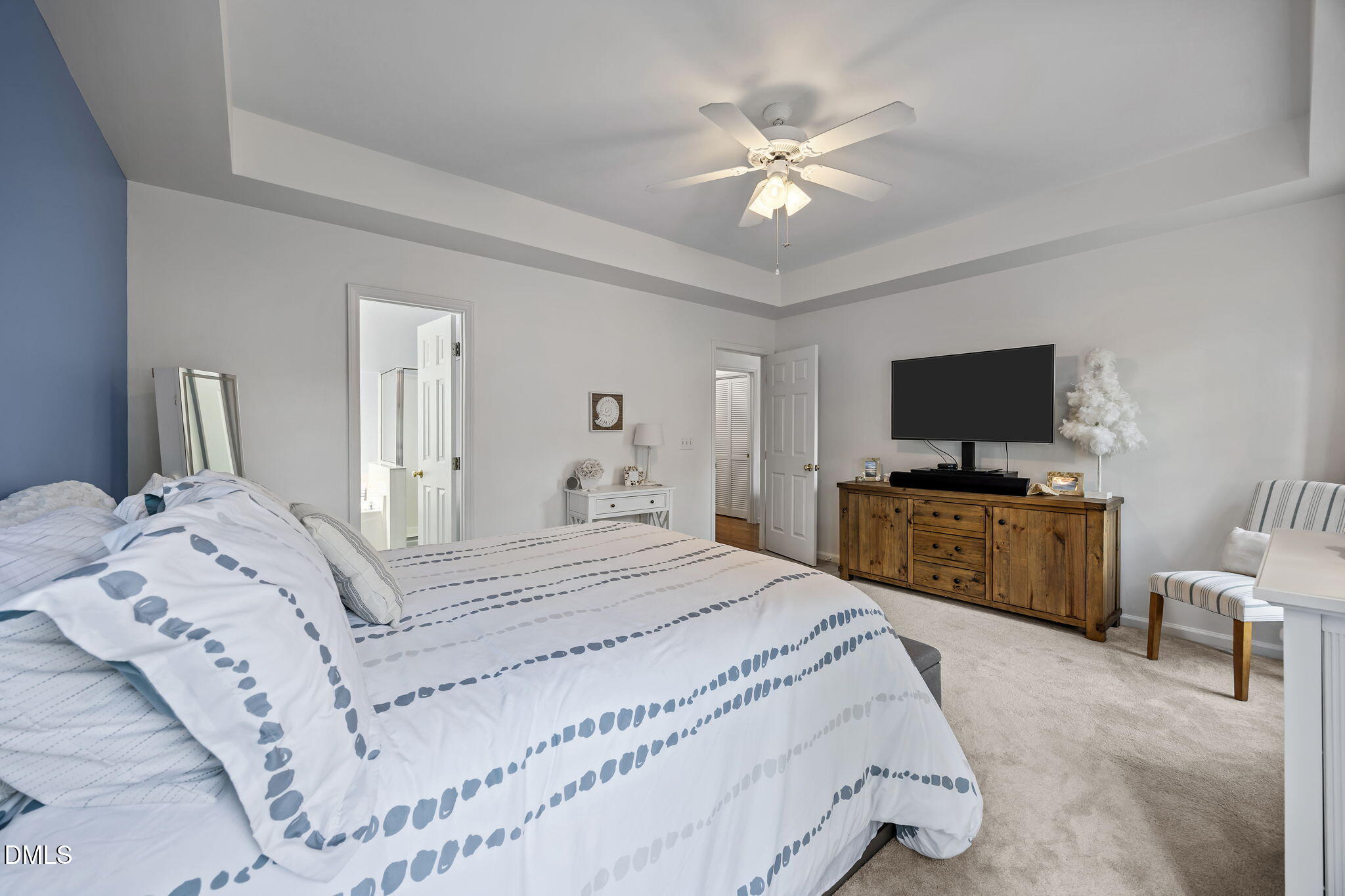 7 Bethany Place Durham, NC 27712 - Photo 17 of 33 a bedroom with a large bed and a flat screen tv
