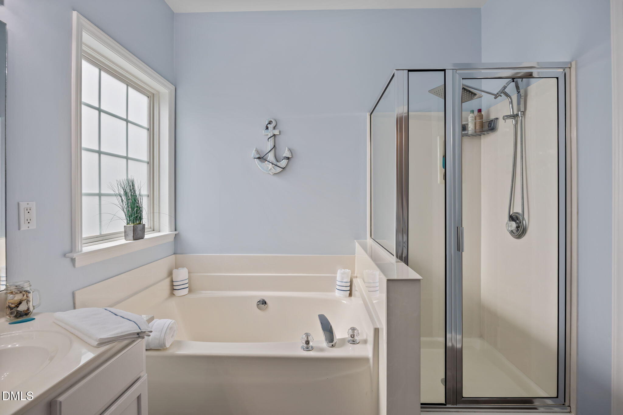 7 Bethany Place Durham, NC 27712 - Photo 19 of 33 a bathroom with a bathtub and a shower