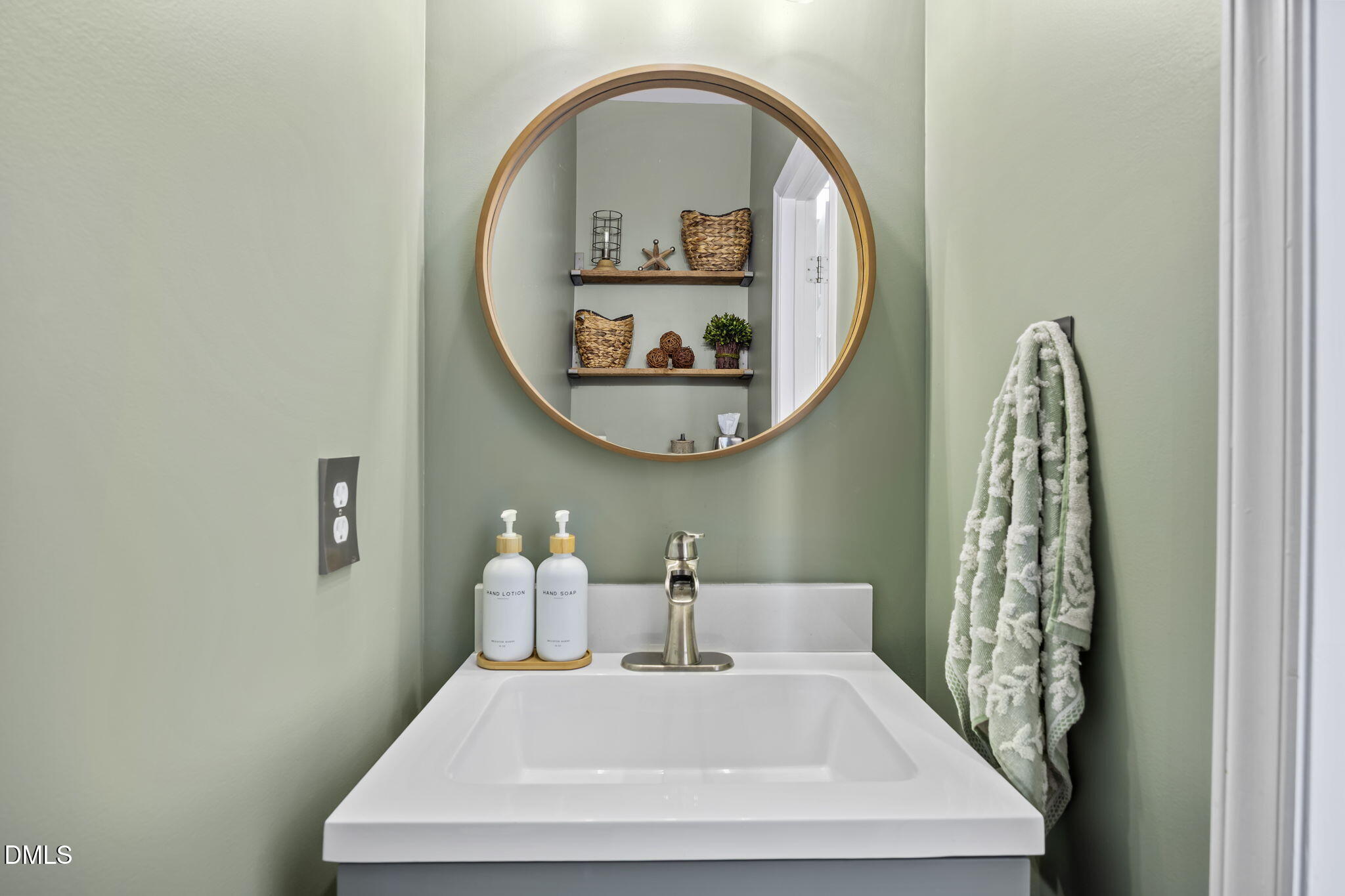 7 Bethany Place Durham, NC 27712 - Photo 5 of 33 a bathroom with a sink and a mirror