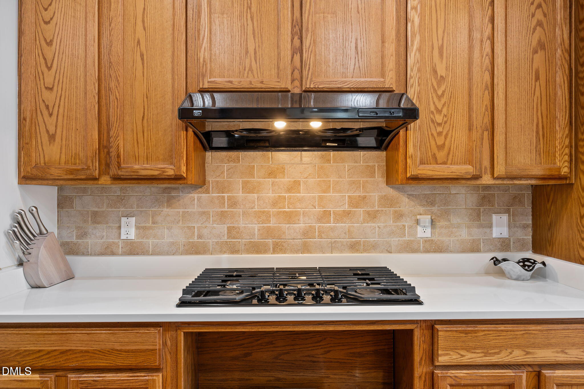 7 Bethany Place Durham, NC 27712 - Photo 10 of 33 a kitchen with granite countertop a stove and cabinets
