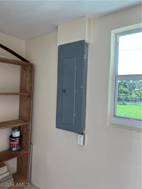 513 Wyoming Road Lehigh Acres, FL 33936 - Photo 27 of 30 a room with storage and utility