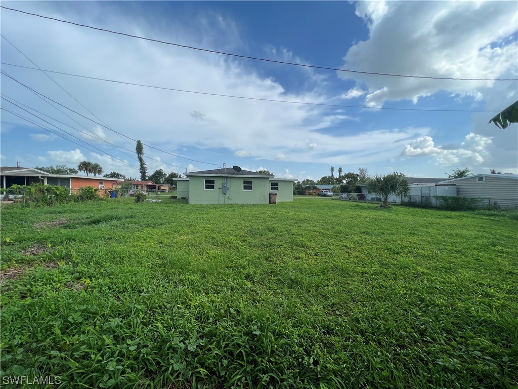 513 Wyoming Road Lehigh Acres, FL 33936 - Photo 30 of 30 a view of a green field