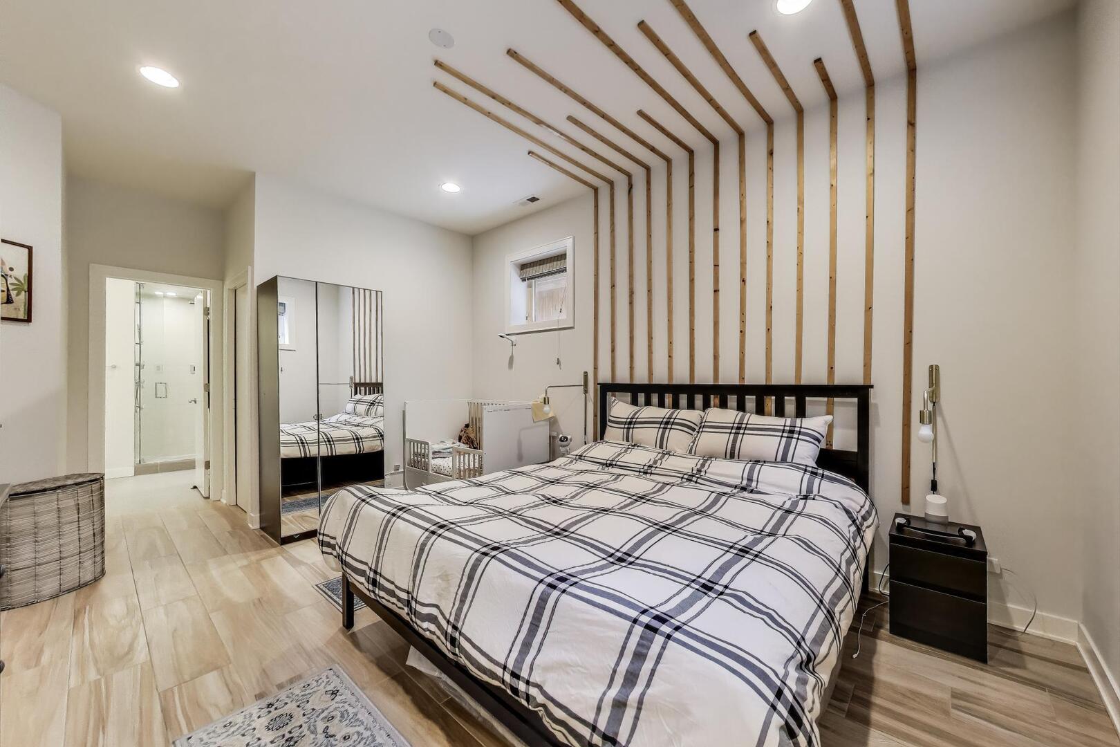 1832 West Rice Street, Unit 1N Chicago, IL 60622 - Photo 13 of 28 a bedroom with a bed and a large mirror on a dresser