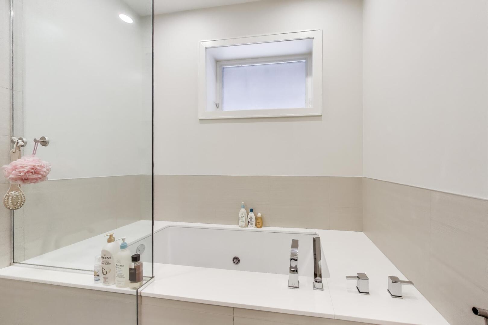 1832 West Rice Street, Unit 1N Chicago, IL 60622 - Photo 16 of 28 a bathroom with a tub and a shower