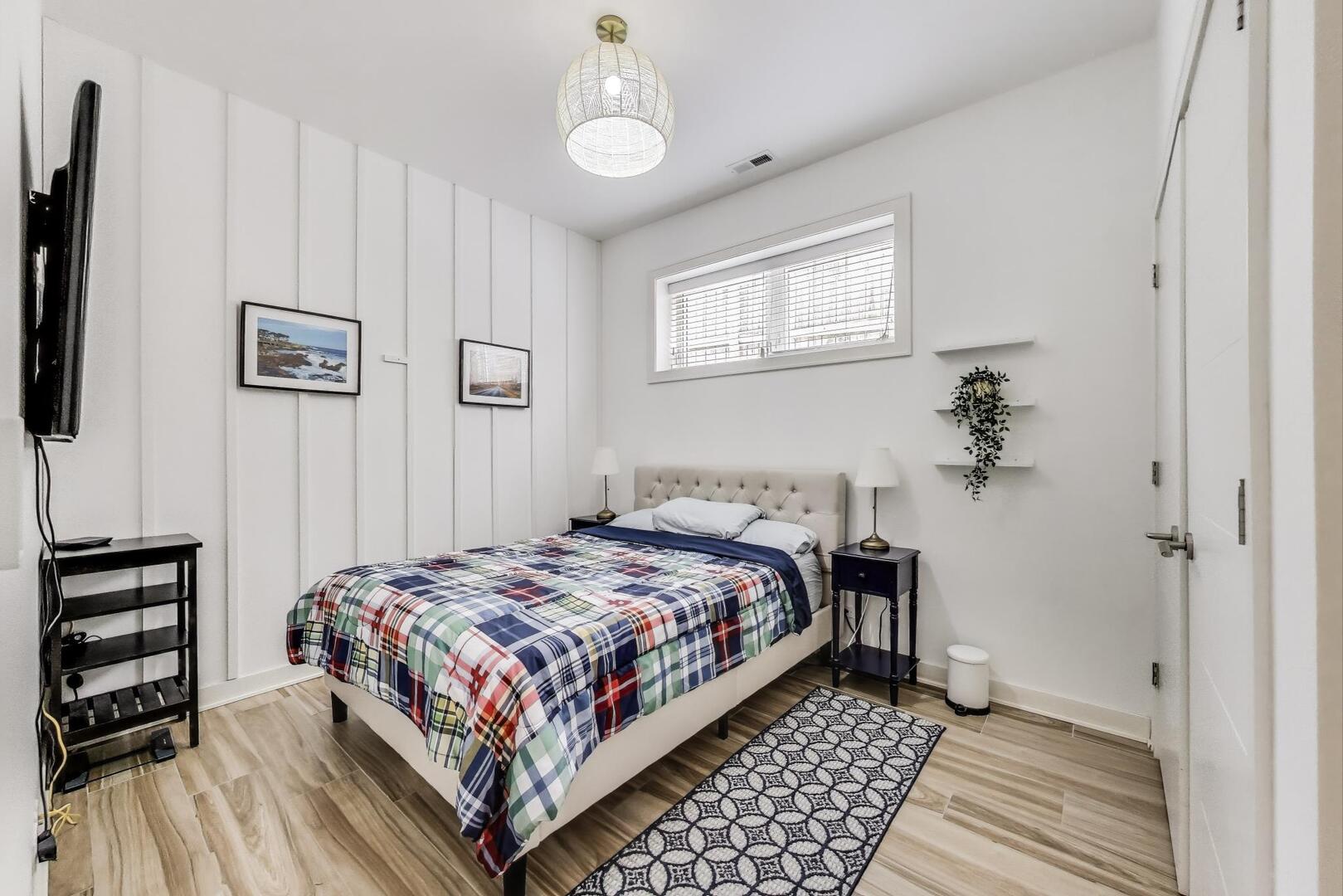 1832 West Rice Street, Unit 1N Chicago, IL 60622 - Photo 17 of 28 a bedroom with a bed and a chandelier