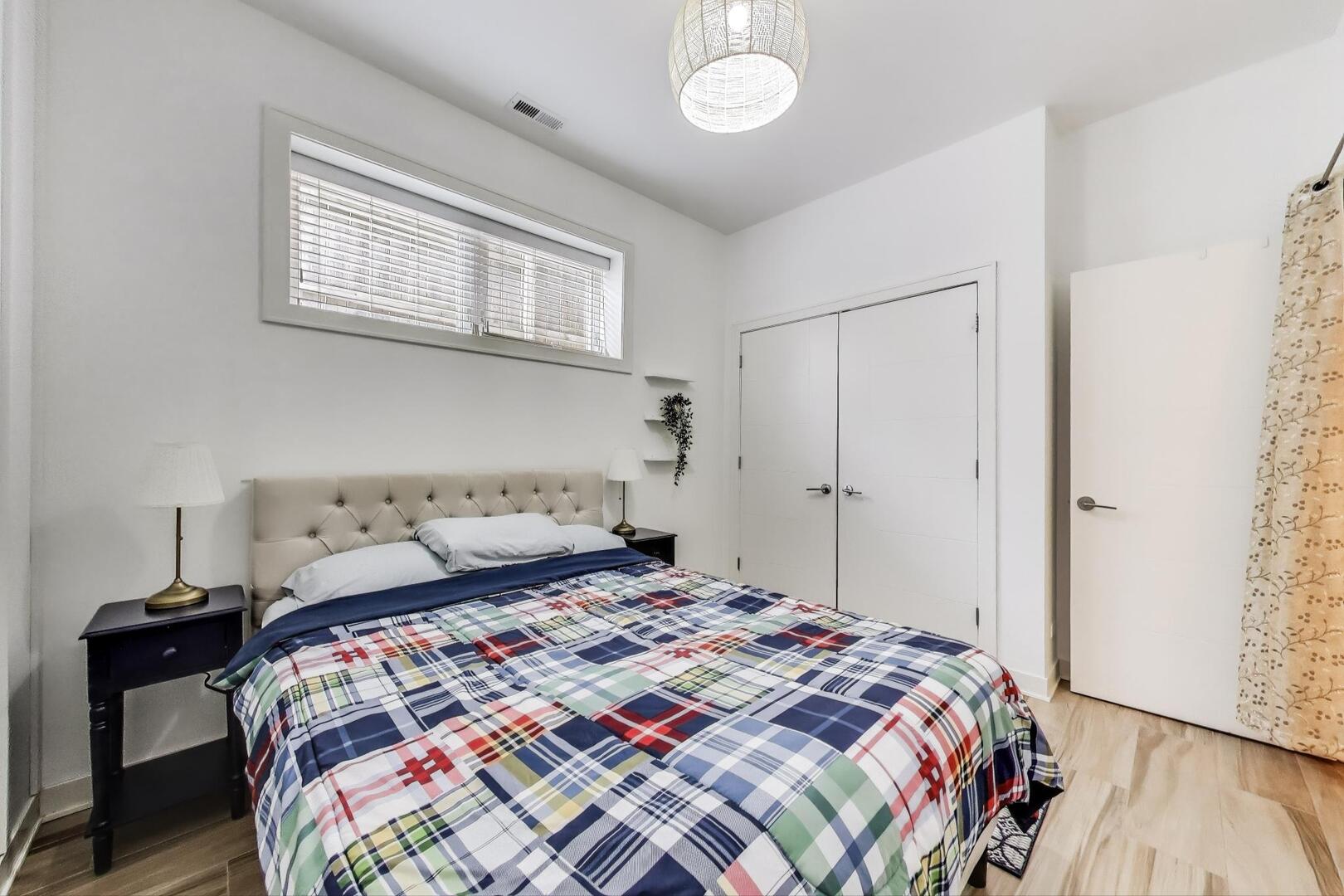 1832 West Rice Street, Unit 1N Chicago, IL 60622 - Photo 18 of 28 a bedroom with a bed and a wooden floor