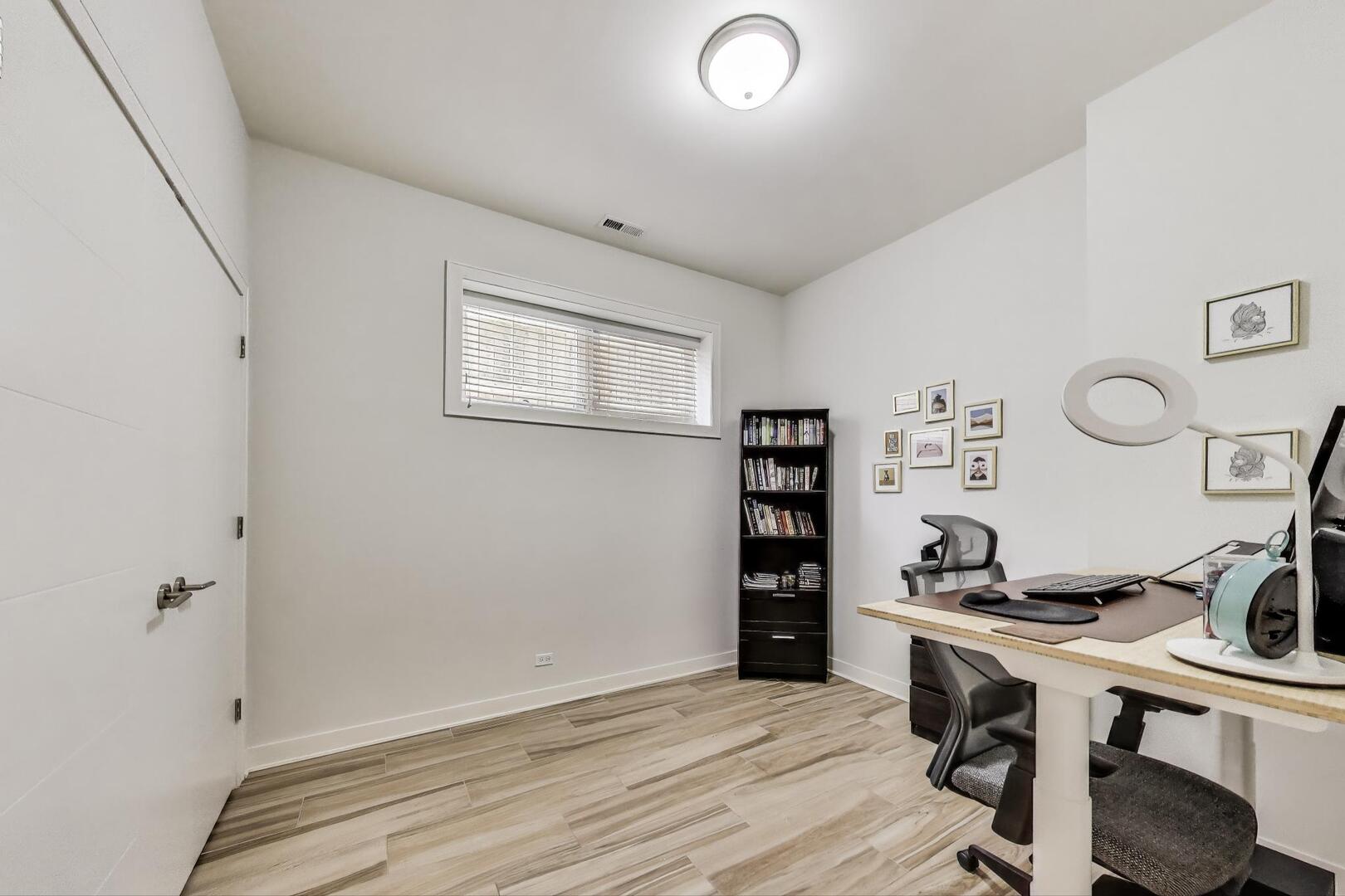 1832 West Rice Street, Unit 1N Chicago, IL 60622 - Photo 19 of 28 a view of a workspace with furniture and wooden floor
