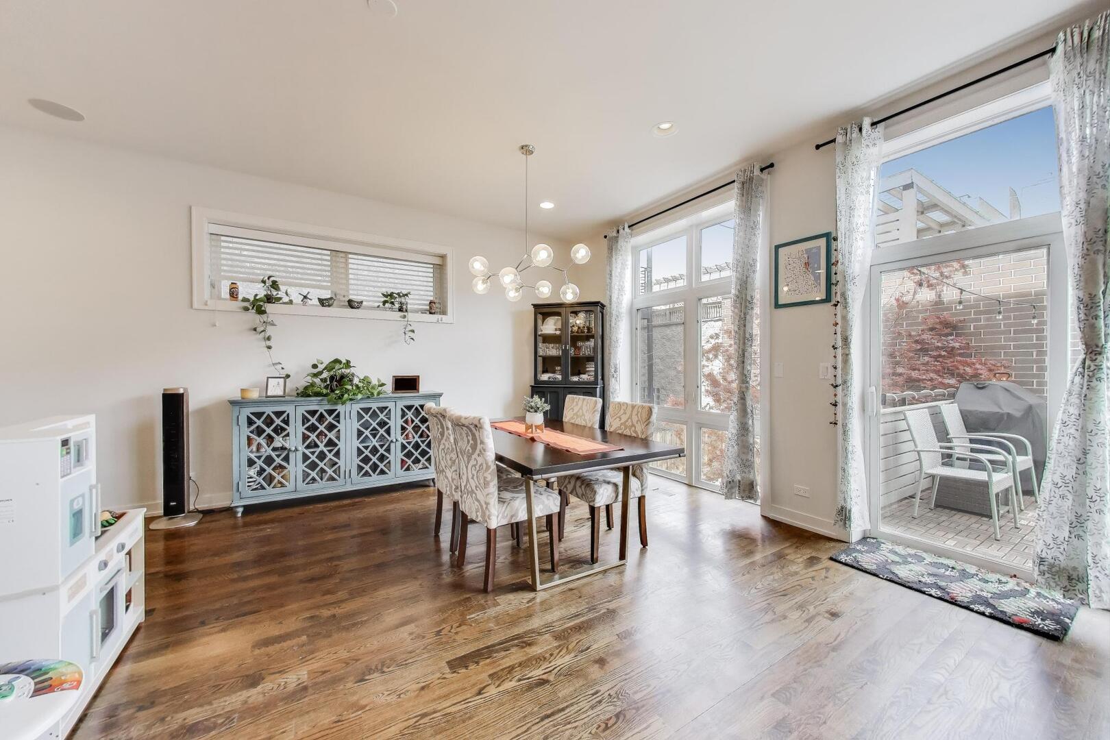 1832 West Rice Street, Unit 1N Chicago, IL 60622 - Photo 7 of 28 a living room with furniture wooden floor and a large window