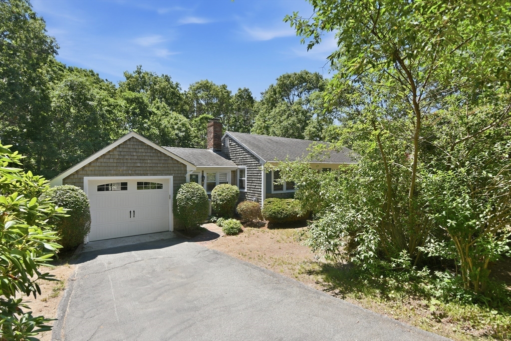 8 Emerald Way Sandwich, MA 02644 - Photo 27 of 36 a view of a house with a yard and large trees
