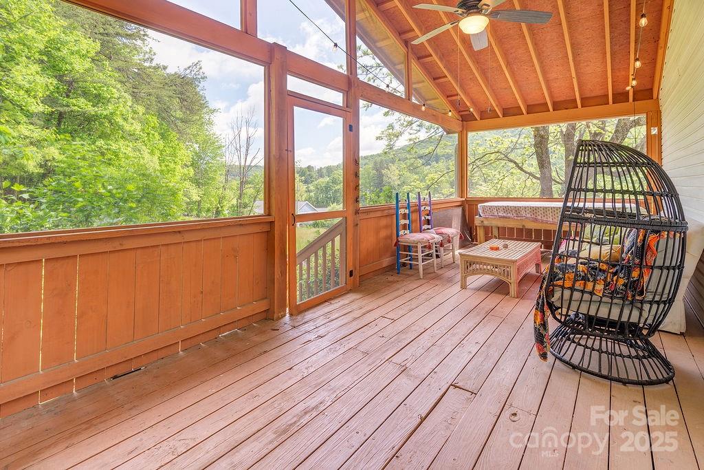 124 Beaverdam Loop Road Candler, NC 28715 - Photo 24 of 31 a view of a two chairs with wooden floor