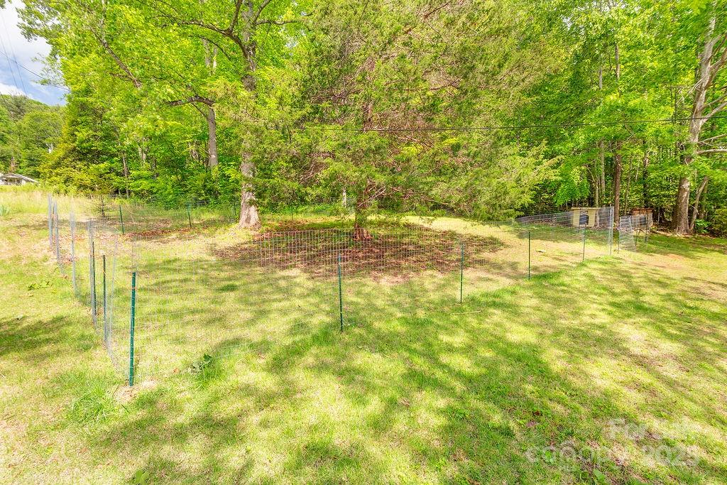 124 Beaverdam Loop Road Candler, NC 28715 - Photo 29 of 31 a view of yard with swimming pool