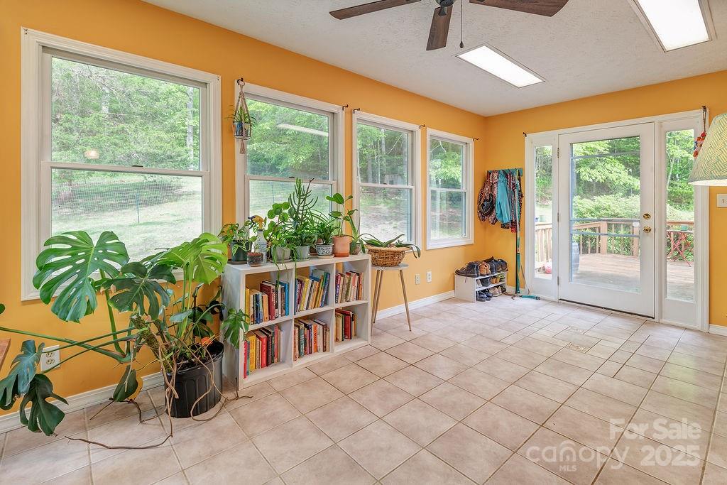 124 Beaverdam Loop Road Candler, NC 28715 - Photo 3 of 31 a very nice looking room with a large window