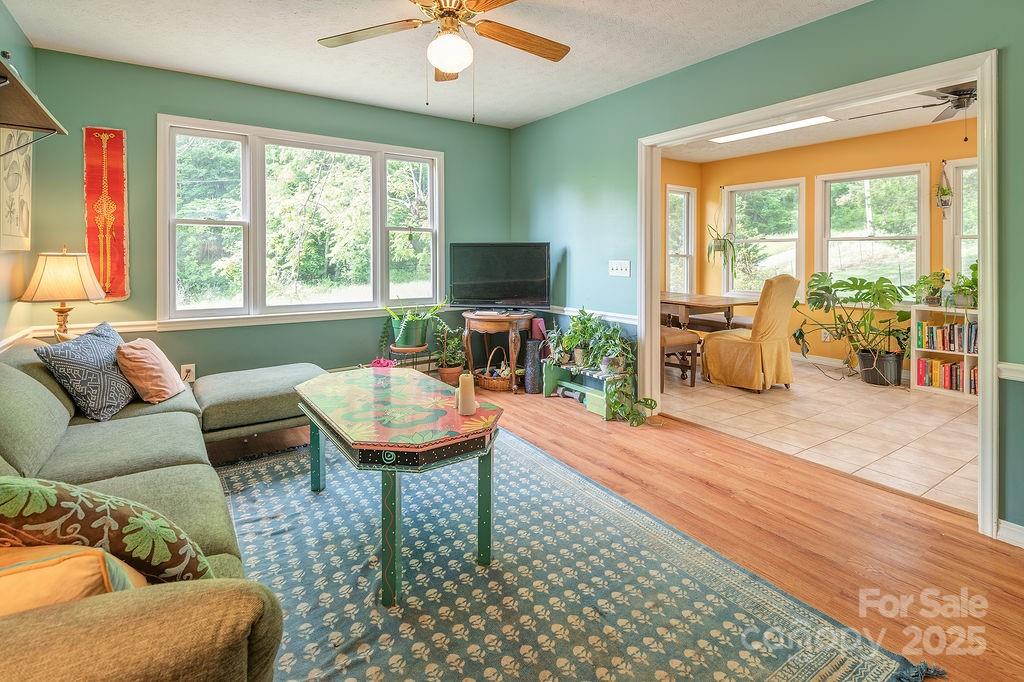 124 Beaverdam Loop Road Candler, NC 28715 - Photo 7 of 31 a living room with furniture and a large window