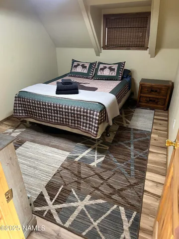 a bedroom with a bed and window