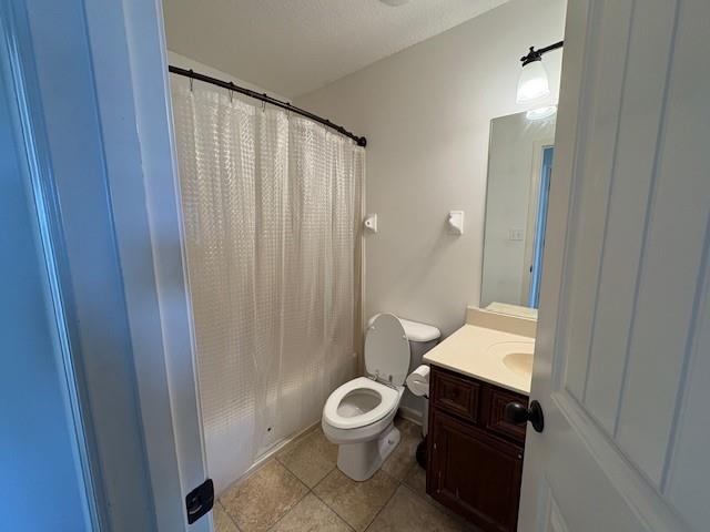 4591 Peppercorn Drive Bartlett, TN 38002 - Photo 24 of 28 Full bath featuring toilet, shower / bathtub combination with curtain, vanity, and tile patterned flooring