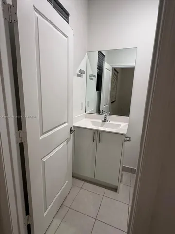 a bathroom with a shower a toilet and a sink