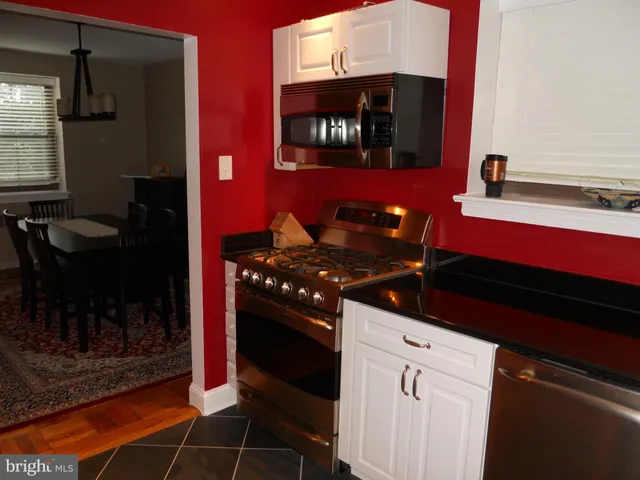 a kitchen with a stove and a microwave