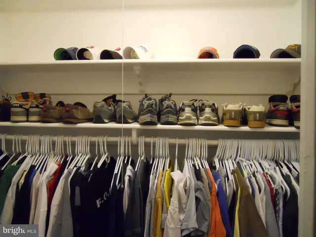 a view of a patio with furniture and a garden