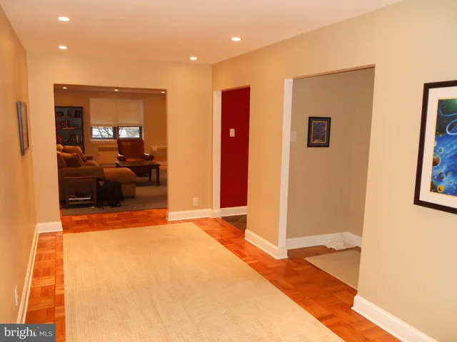 a view of a living room with a balcony and furniture