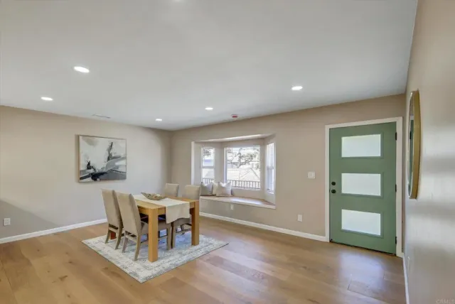 a kitchen with granite countertop a sink stainless steel appliances and cabinets