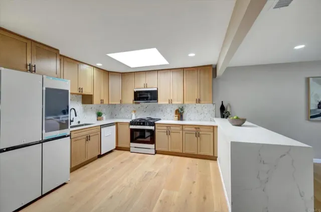 a kitchen with a stove and a microwave