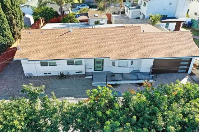 an aerial view of a house with outdoor space