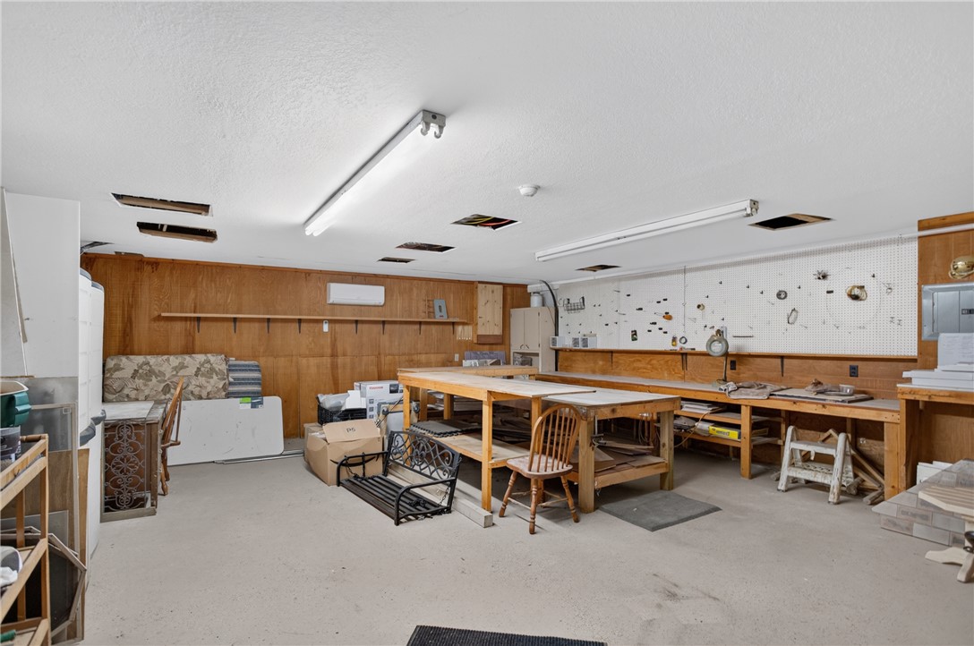 351 River Road Westminster, SC 29693 - Photo 40 of 50 A well-equipped workshop space offers ample room for creative projects and storage solutions. This is located under the home and accessed from its own exterior door.