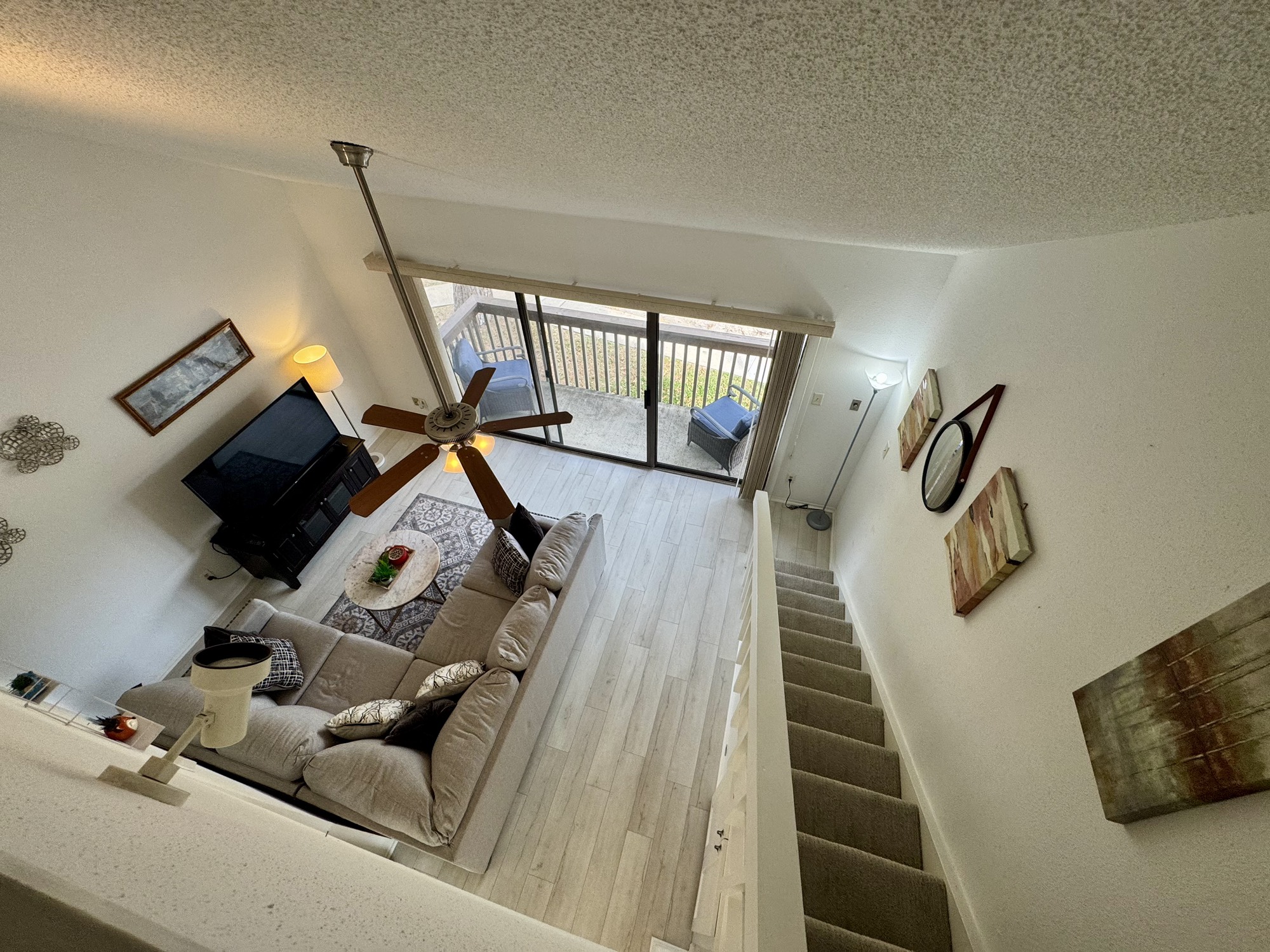 12900 Walden Road, Unit 820 Montgomery, TX 77356 - Photo 1 of 14 a living room with furniture and a wooden floor