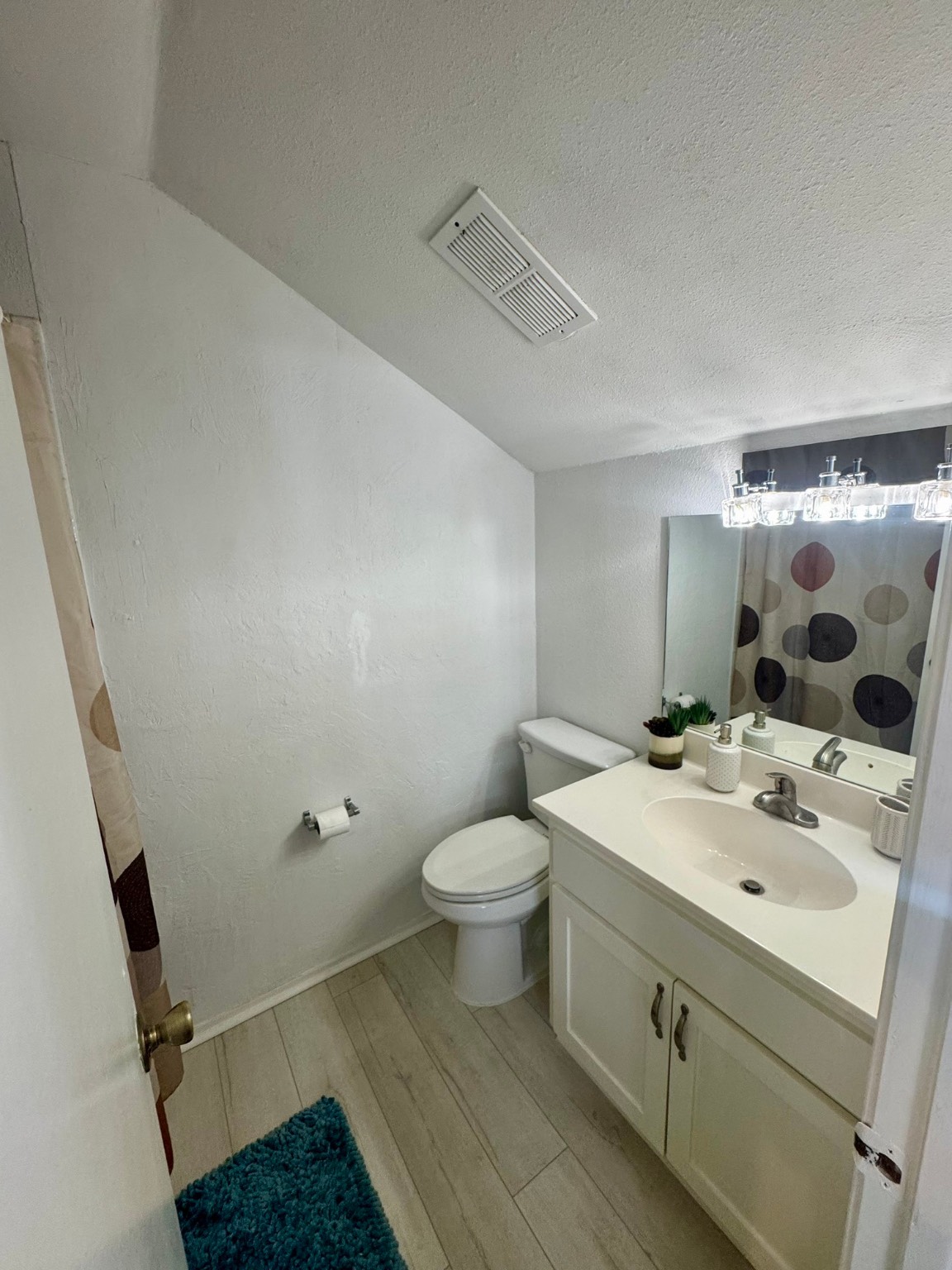 12900 Walden Road, Unit 820 Montgomery, TX 77356 - Photo 13 of 14 a bathroom with a sink toilet and shower