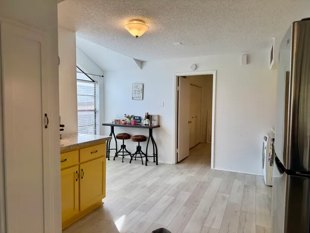 a view of a livingroom with furniture and a window