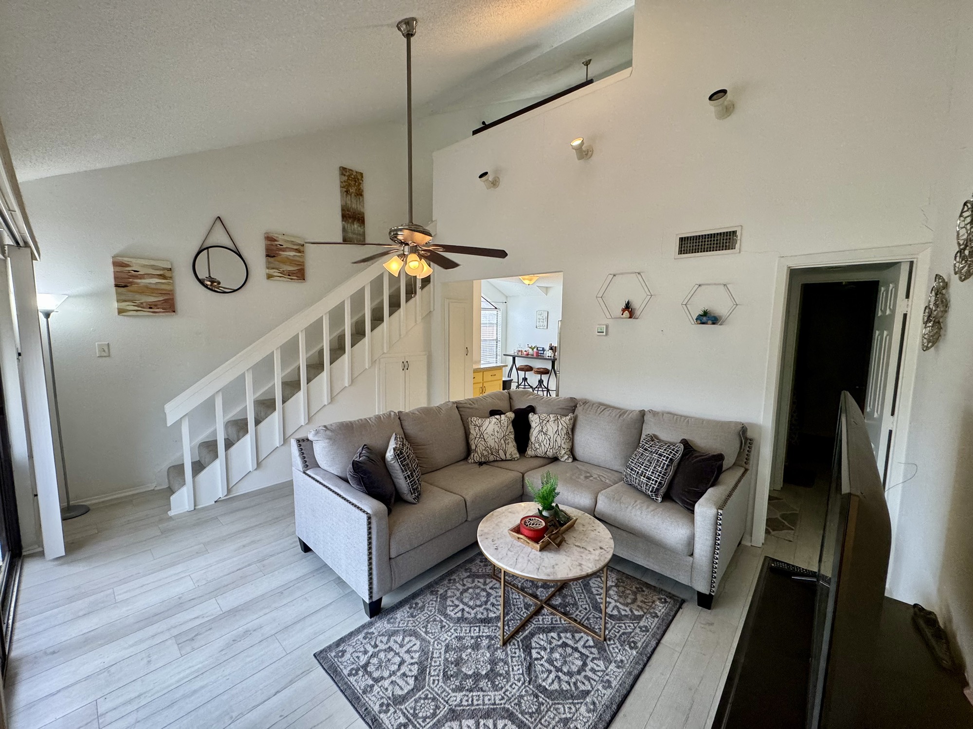12900 Walden Road, Unit 820 Montgomery, TX 77356 - Photo 7 of 14 a living room with furniture and a wooden floor