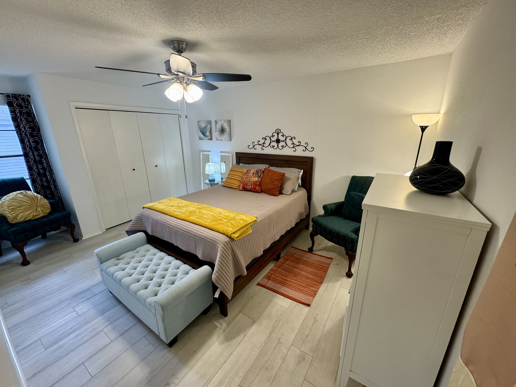 12900 Walden Road, Unit 820 Montgomery, TX 77356 - Photo 9 of 14 a bedroom with a bed and a chandelier