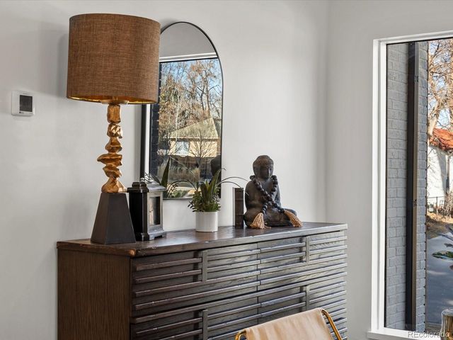 a kitchen with stainless steel appliances granite countertop a refrigerator a sink dishwasher a stove and a refrigerator with wooden floor