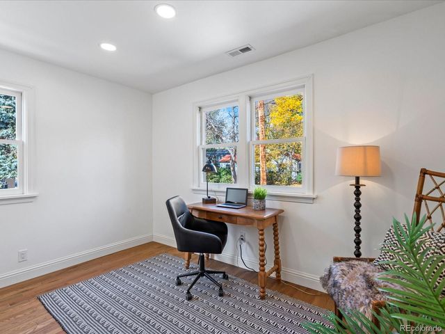 a bedroom with a bed and a table in it