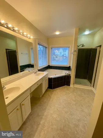 a white toilet sitting next to a sink