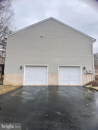 a house with yard and a parking space