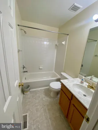 a view of a room with projector and screen