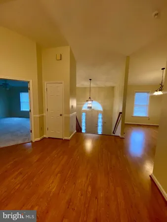 a view of entryway with wooden floor